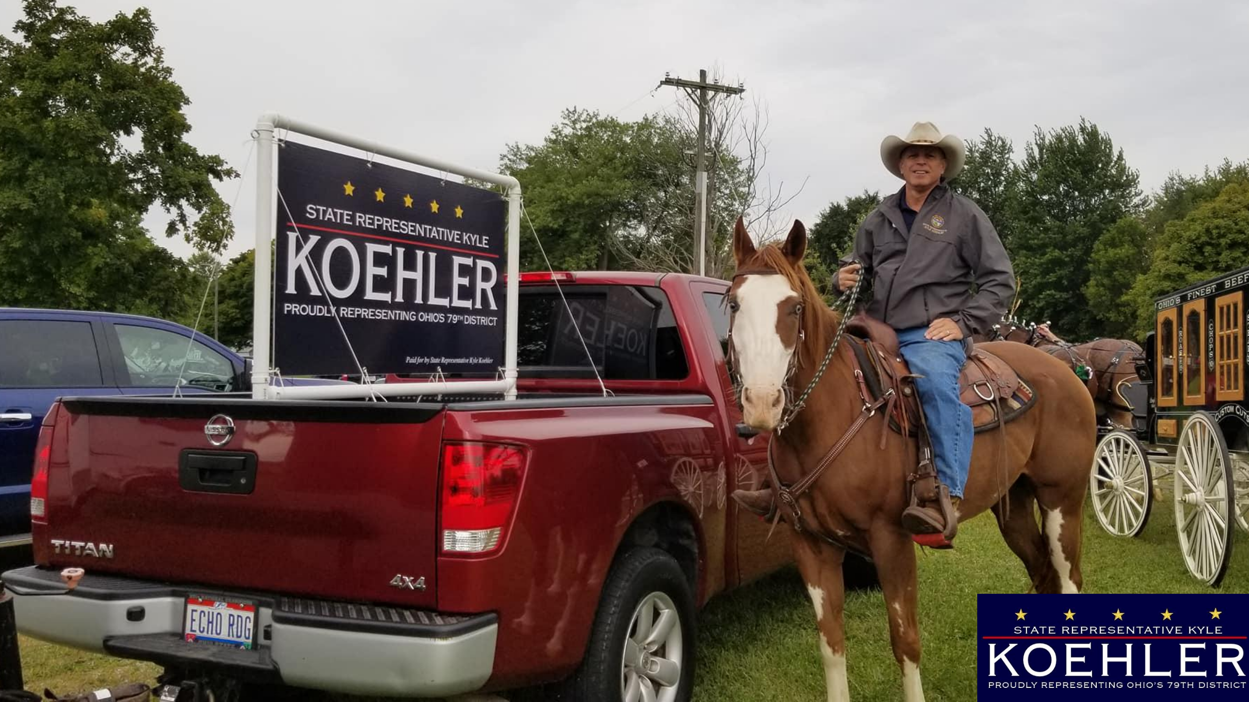 Kyle Koehler on top of a brown horse beside a Red Truck